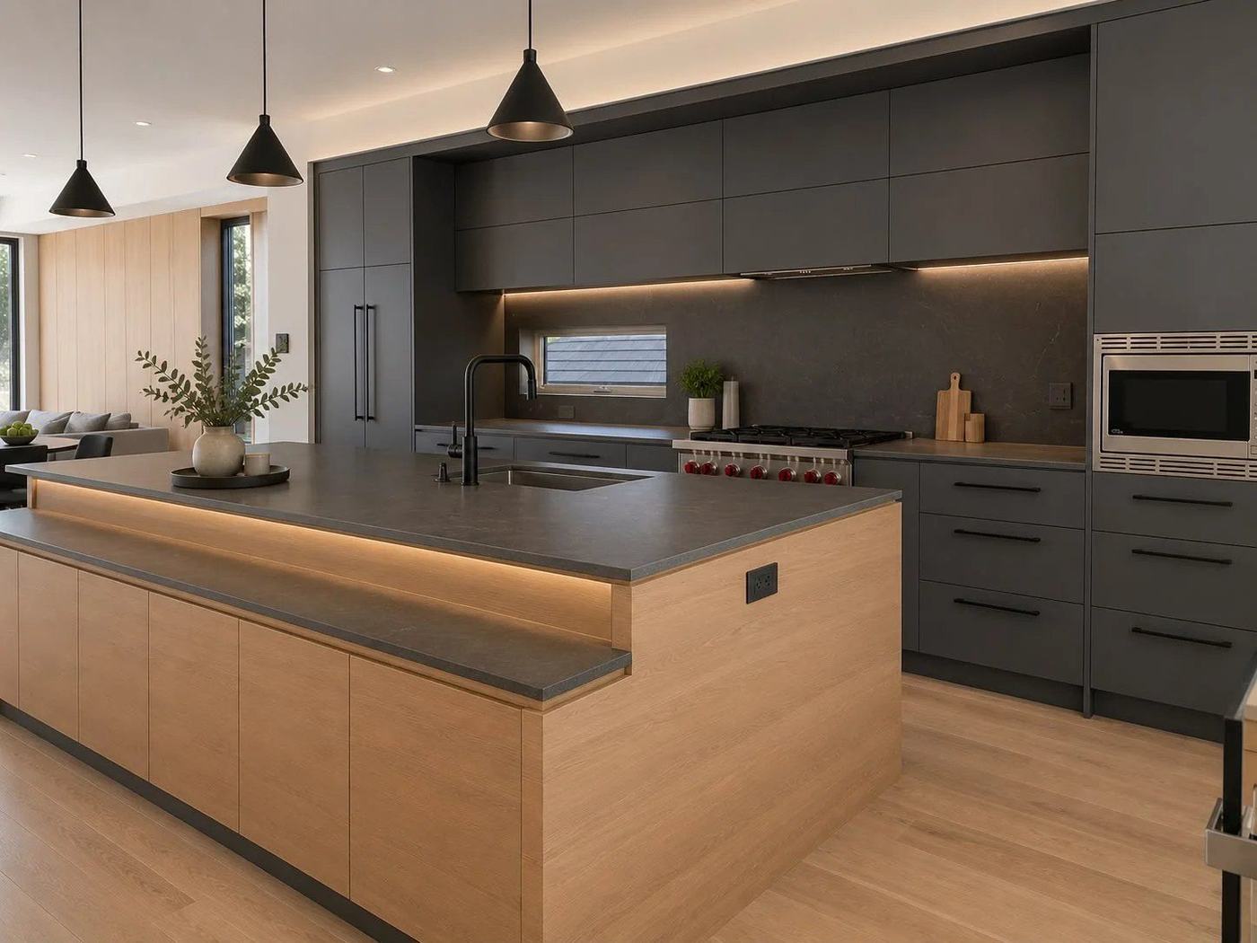 Charcoal and white oak kitchen with a two-level island and black cone pendants in Thornhill, by NewGen Renovations Vaughan